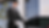 Smiling chauffeur in uniform opening car door, White Glove Transportation OC