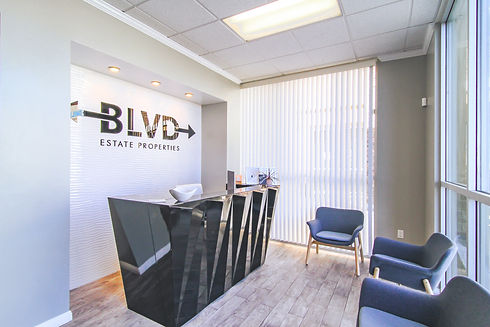 Photo of instead the office of BLVD Estate properties. The reception area has a black desk and chair