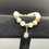 Thumbnail: Trochidae, Moonstone, and Selenite Beaded Bracelet