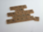 Scrabble tiles spell "Done is better than perfect" on a white background, promoting a motivational message.