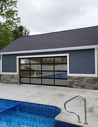 Modern glass commercial door on a pool house building.