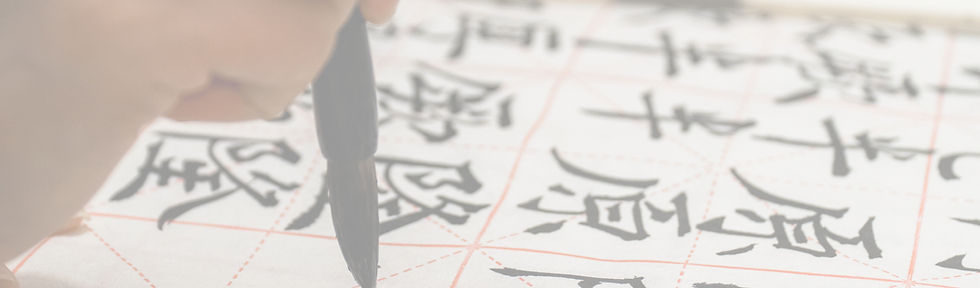 person writing on white paper_edited.jpg