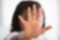 Girl Making Stop Sign On Defocused Background.jpg