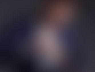 Magician performing a card flourish during a close-up magic show in New York City