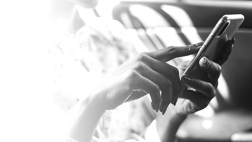 woman-using-phone-car_edited.jpg
