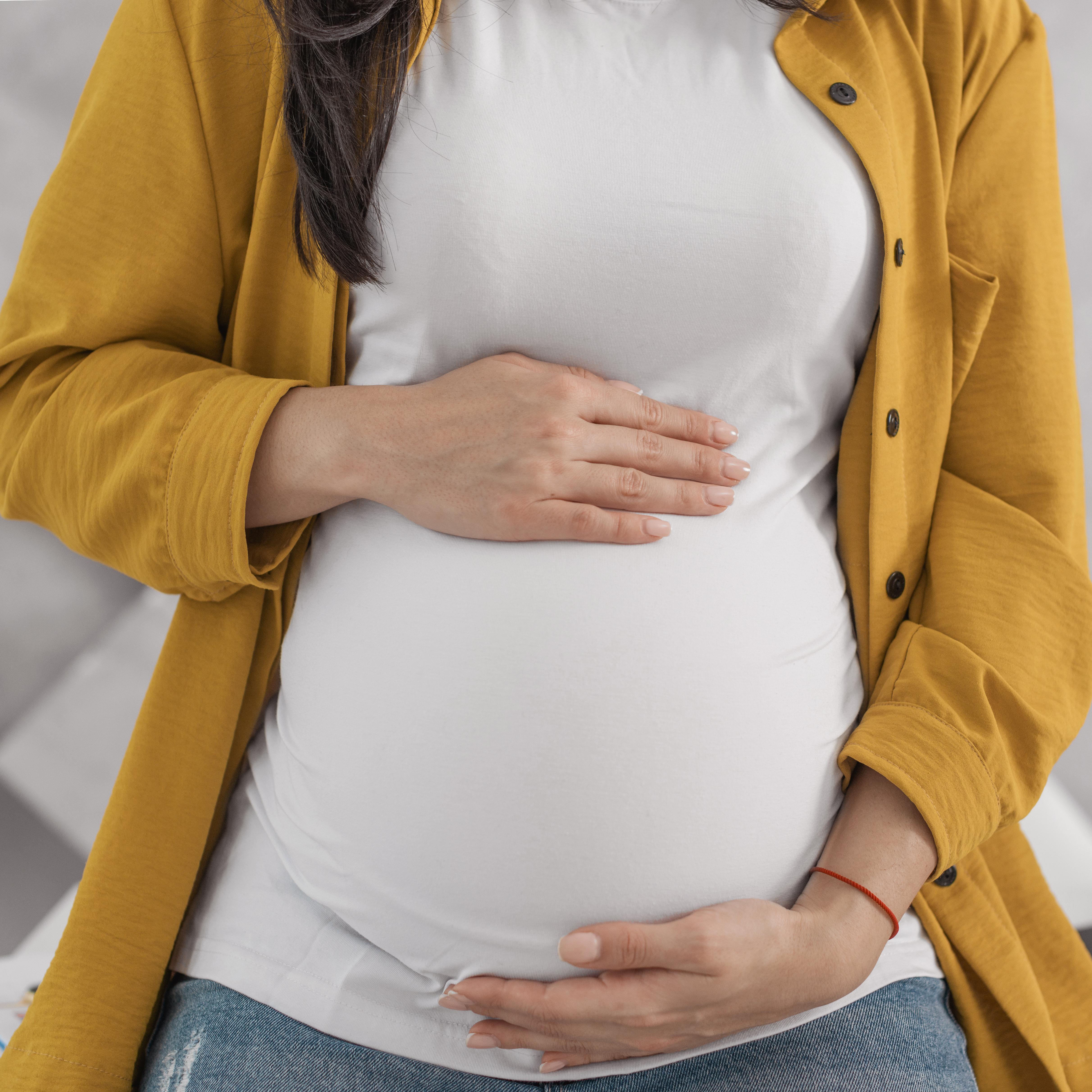 pregnant-woman-holding-her-belly.jpg
