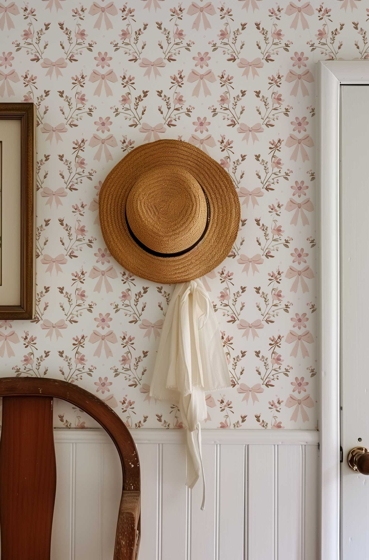Removable wallpaper featuring powder pink bows and small flowers on a white background.