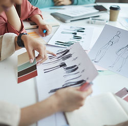 designers-examining-fashion-sketches-2021-08-27-22-16-14-utc.jpg