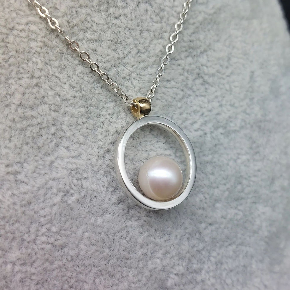 Silver and 9ct yellow gold Southsea pearl pendant