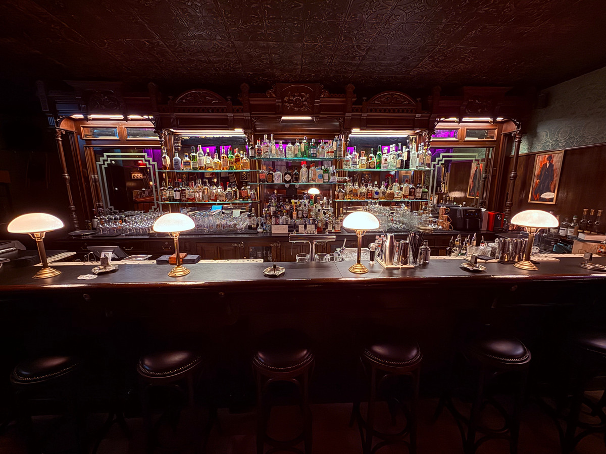 The mirrored back bar and spirits shelf at Twent's