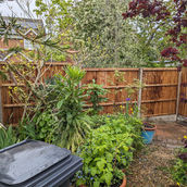 close board panels with concrete posts concrete gravel boards rear view