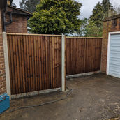 feather edge bays with concrete posts and concrete gravel boards