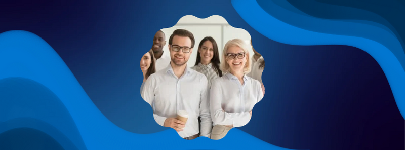 a group of people are standing next to each other and smiling for the camera .