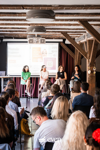 Panelists speaking at the event