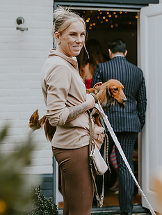 Woman with dog at wedding