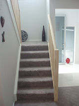 Timber square balustrade and post carpet staircase