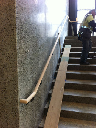 Custom wall mounted continuous handrail on brackets