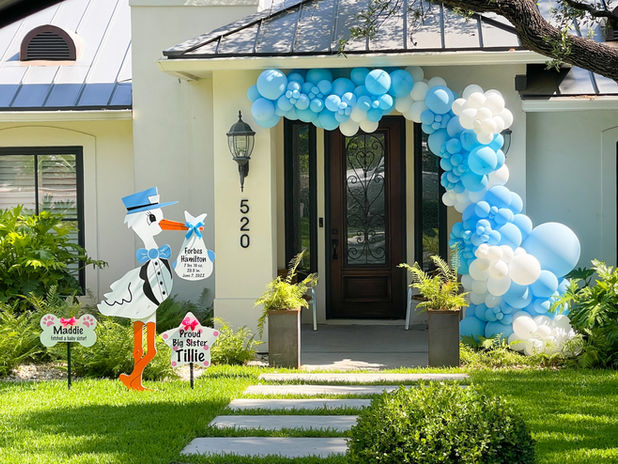 Blue Boy Baby Announcement Stork with Sister Sibling Star and Dog Bone. White house with blue balloon arch.