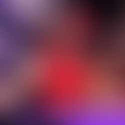 Woman performing a shoulder press exercise on a resistance machine at a gym, focusing on upper-body strength training.