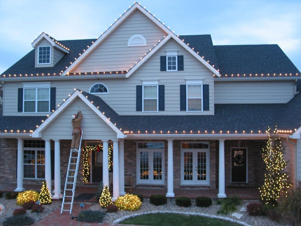 <img src="Christmas light installation.png" alt="ladder safety tips for Christmas light installation">
