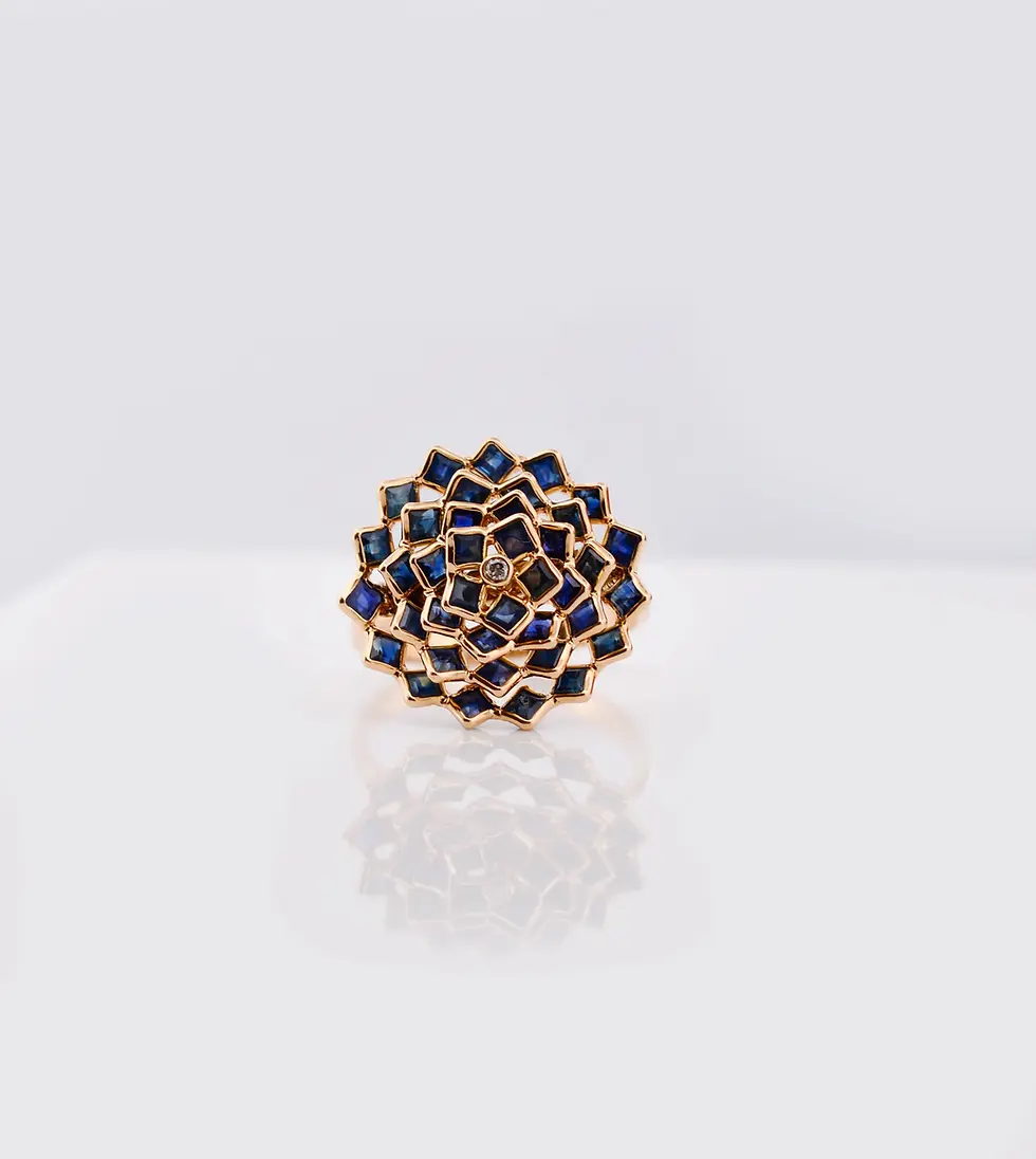 18K solid gold blue sapphire statement ring featuring a floral mandala design with deep blue gemstones in an intricate cluste
