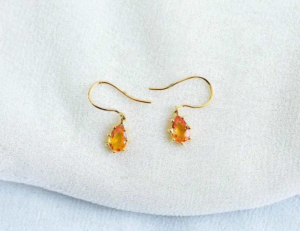 18K gold drop earrings with natural orange gemstone, lightweight everyday fine jewellery on soft fabric background