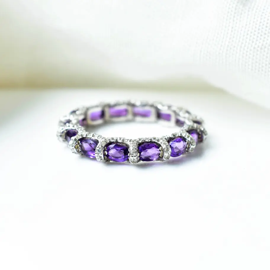 Minimalist amethyst gemstone stacking ring styled for everyday elegant wear