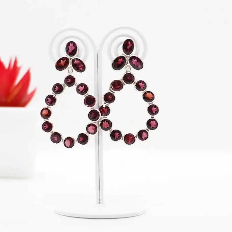 925 sterling silver chandelier earrings with deep red natural garnet gemstones arranged in a teardrop design