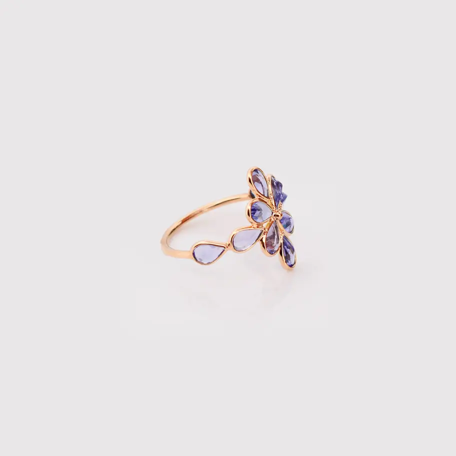 18K solid gold natural tanzanite flower ring with petal-shaped gemstones in an elegant floral cluster design