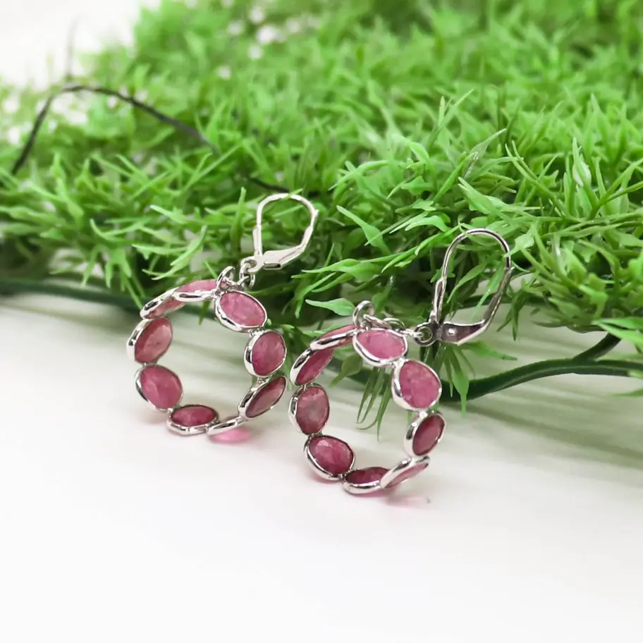 925 sterling silver drop earrings with rectangular pink tourmaline gemstones displayed on a minimal white jewellery stand