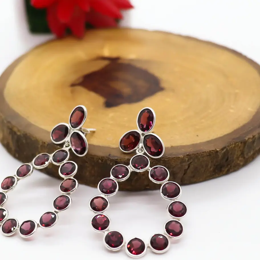 925 sterling silver chandelier earrings with deep red natural garnet gemstones arranged in a teardrop design