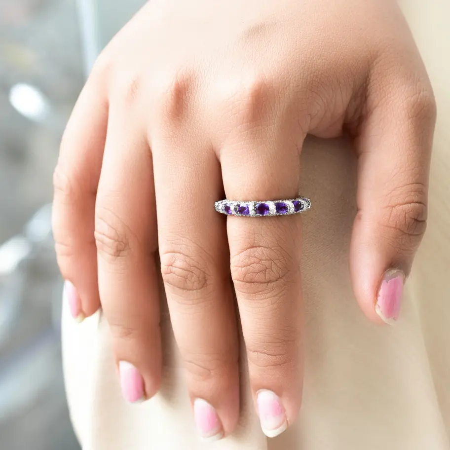 Minimalist amethyst gemstone stacking ring styled for everyday elegant wear