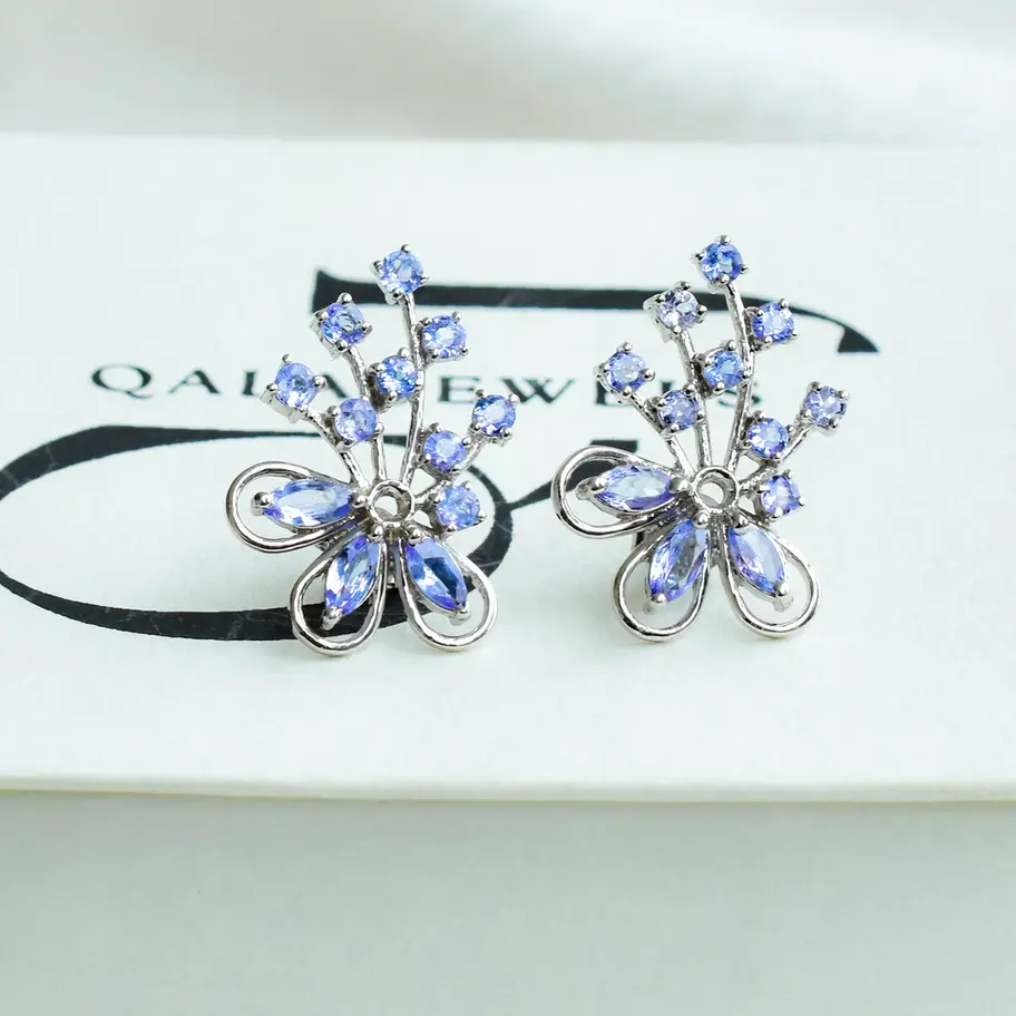 925 sterling silver floral tanzanite stud earrings featuring marquise and round-cut blue-violet gemstones arranged in a delic