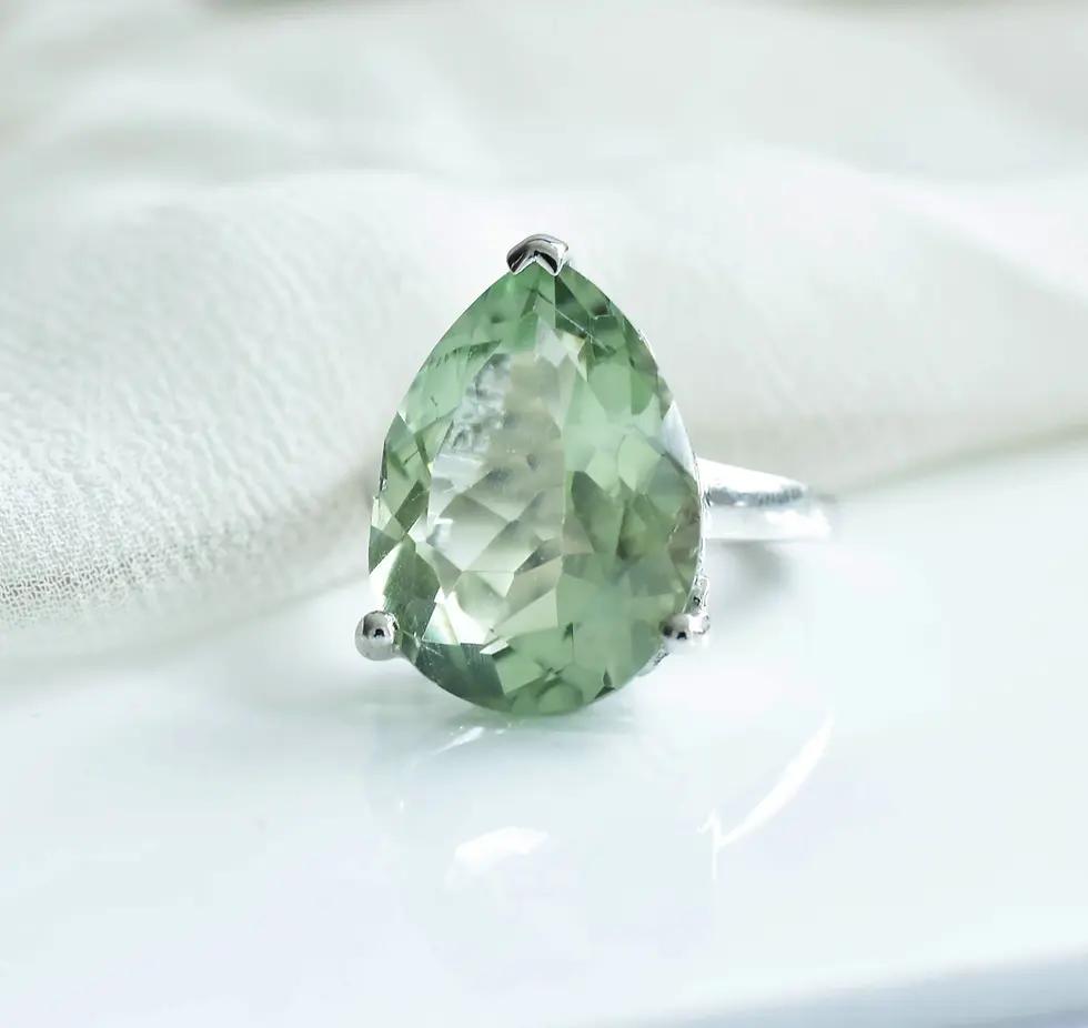 Pear cut green amethyst gemstone ring in sterling silver with soft pastel green tone and minimalist setting