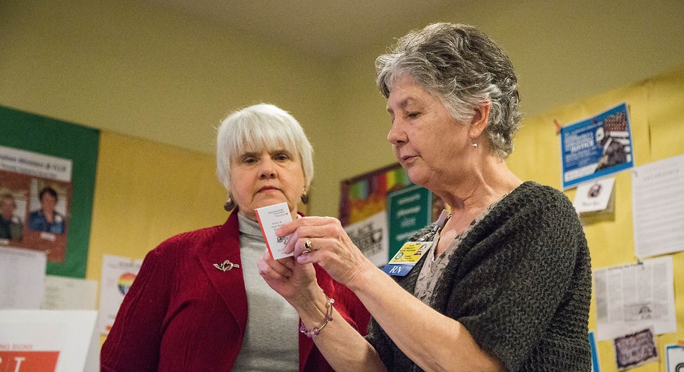 Jeanne Brotherton, FCN, assists a congregant at First Congregational United Church of Christ, Bellingham.