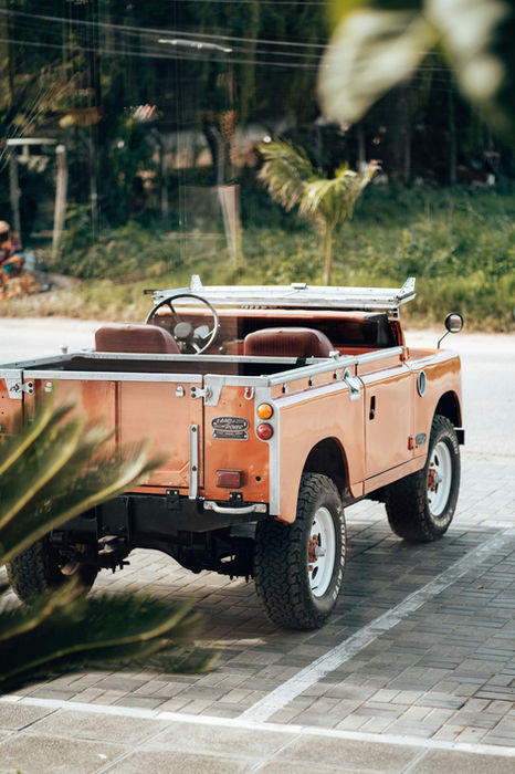 Safari jeep driving through lush tropical landscape in Zanzibar, illustrating personalised guided tours and adventure experiences