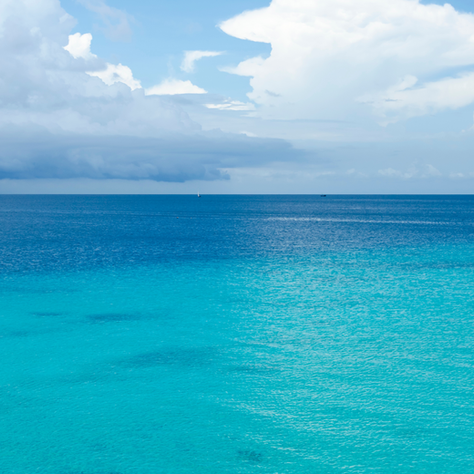 Aerial view of Zanzibar coastline with turquoise waters and modern real estate developments, illustrating sustainable growth aligned with Vision 2050 - article by Ocean Properties