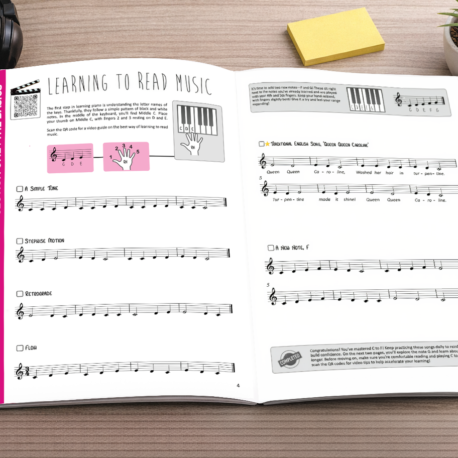Inside pages of the Master the Piano method book showing clear piano instruction and QR-linked video support