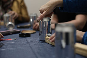 women building a camp stove