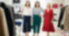 Three stylish women of different heights and builds pose in a boutique, highlighting the need for realistic petite clothing options in NZ.