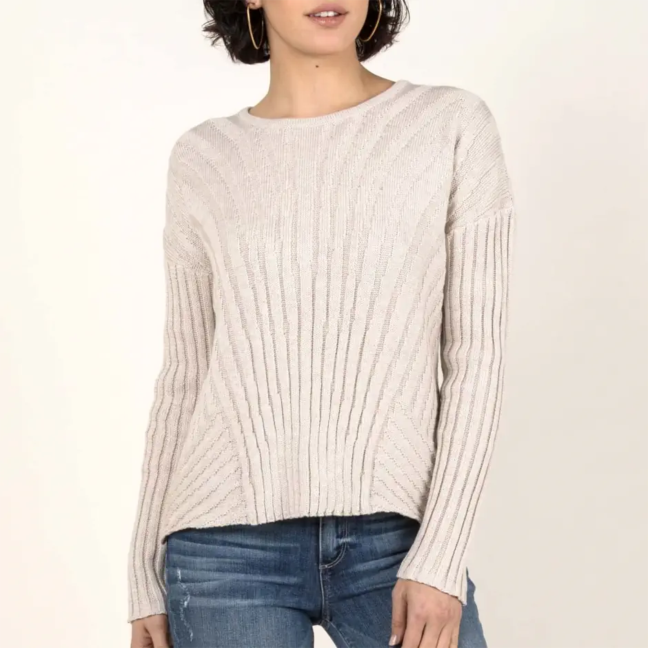 Woman wearing a relaxed, textured knit jumper with casual jeans, reflecting the comfortable, effortless look of the natural style personality.
