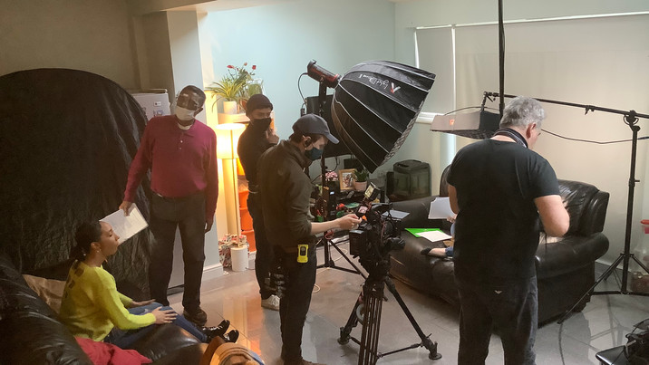 Hacking away at the job. That's Sophia Sinclair on the settee.