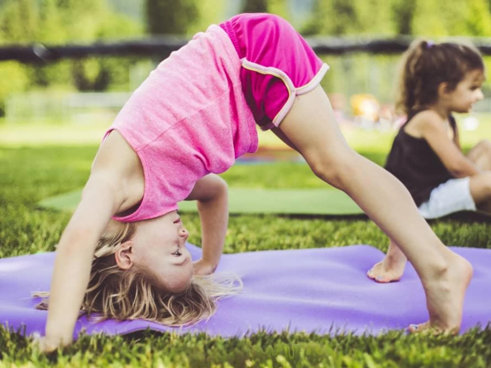 kids-doing-yoga-in-a-park.webp