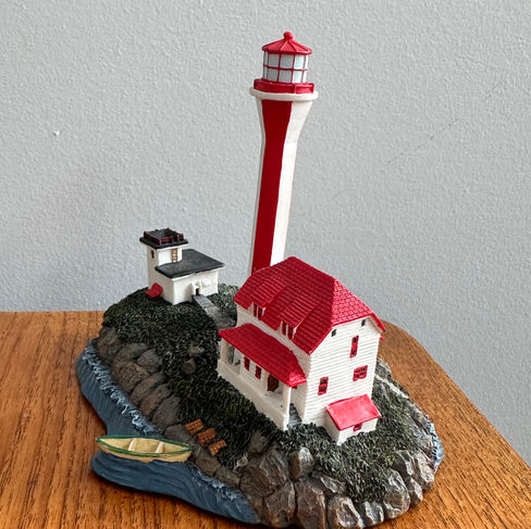 A miniature lighthouse figurine.