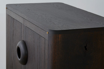 Dark wood cabinet, corner detail