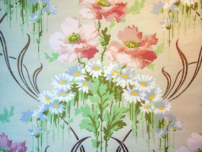 Floral wallpaper design with pink flowers and white flowers with green leaves. 