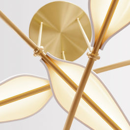 Detail view of the Spire chandelier, made of brass and pocelain.