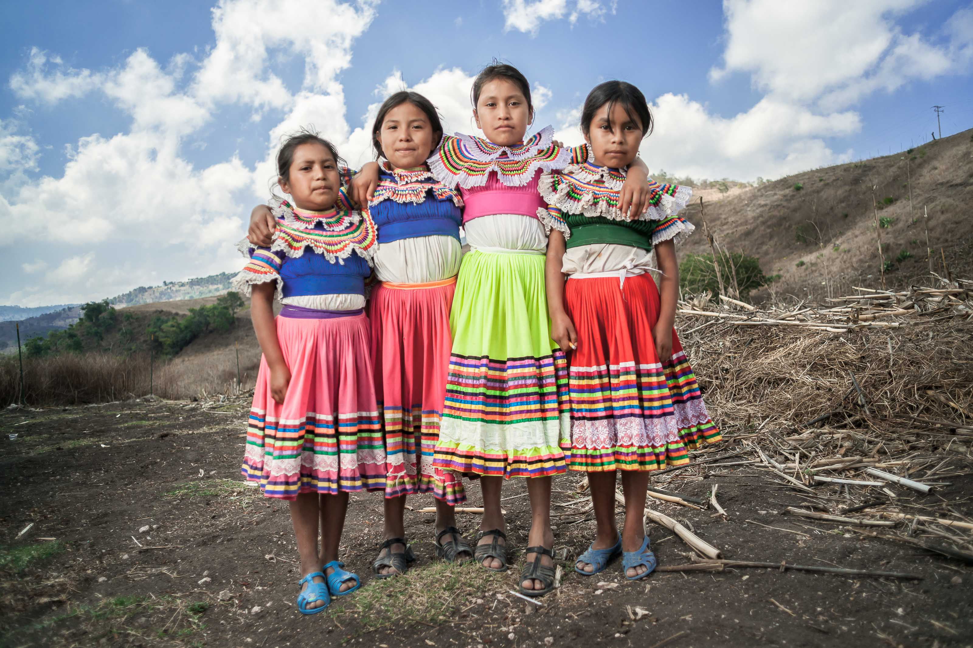 The Natives - Nahua of Guerrero | Four schoolgirls posing outside their school
