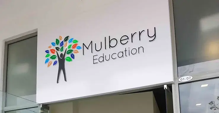 Signage of Mulberry Education shows a happy stick figure