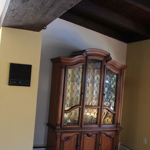 The flooding cabinet wall I created was built-in by Simply Cabinetry and beautiful table set from Creative Dinettes making this space comfortable and functional.